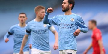 MANCHESTER, ENGLAND - JANUARY 10: Bernardo Silva of Manchester City celebrates after scoring their side's first goal during the FA Cup Third Round match between Manchester City and Birmingham City at Etihad Stadium on January 10, 2021 in Manchester, England. Sporting stadiums around England remain under strict restrictions due to the Coronavirus Pandemic as Government social distancing laws prohibit fans inside venues resulting in games being played behind closed doors. (Photo by Alex Livesey/Getty Images)