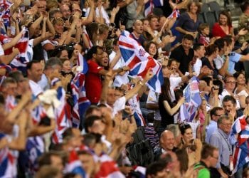 LONDON, ENGLAND - AUGUST 05:  Spectators cheer in the stands as Victoria Pendleton of Great Britain breaks the Olympic record as she competes during the Women's Sprint Track Cycling Qualifying on Day 9 of the London 2012 Olympic Games at Velodrome on August 5, 2012 in London, England.  (Photo by Bryn Lennon/Getty Images)