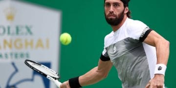 SHANGHAI, CHINA - OCTOBER 10:  Nikoloz Basilashvili of Georgia hits a return against Alexander Zverev of Germany during second round of the 2018 Rolex Shanghai Masters on Day 4 at Qi Zhong Tennis Centre on October 10, 2018 in Shanghai, China.  (Photo by Lintao Zhang/Getty Images)