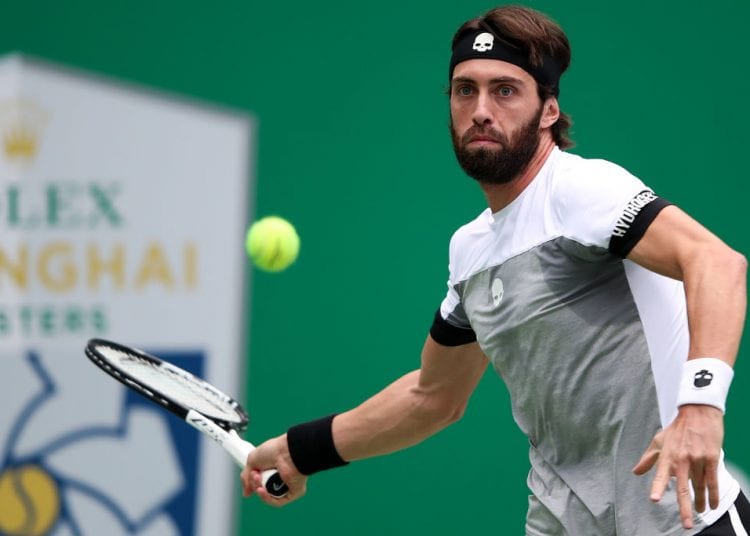 SHANGHAI, CHINA - OCTOBER 10:  Nikoloz Basilashvili of Georgia hits a return against Alexander Zverev of Germany during second round of the 2018 Rolex Shanghai Masters on Day 4 at Qi Zhong Tennis Centre on October 10, 2018 in Shanghai, China.  (Photo by Lintao Zhang/Getty Images)
