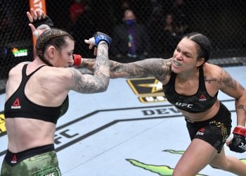 LAS VEGAS, NEVADA - MARCH 06: (R-L) Amanda Nunes of Brazil punches Megan Anderson of Australia in their UFC featherweight championship fight during the UFC 259 event at UFC APEX on March 06, 2021 in Las Vegas, Nevada. (Photo by Jeff Bottari/Zuffa LLC)