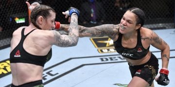 LAS VEGAS, NEVADA - MARCH 06: (R-L) Amanda Nunes of Brazil punches Megan Anderson of Australia in their UFC featherweight championship fight during the UFC 259 event at UFC APEX on March 06, 2021 in Las Vegas, Nevada. (Photo by Jeff Bottari/Zuffa LLC)