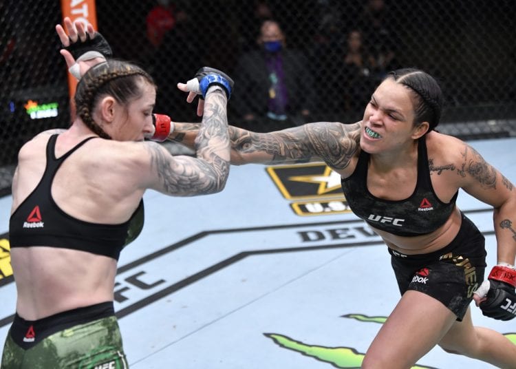 LAS VEGAS, NEVADA - MARCH 06: (R-L) Amanda Nunes of Brazil punches Megan Anderson of Australia in their UFC featherweight championship fight during the UFC 259 event at UFC APEX on March 06, 2021 in Las Vegas, Nevada. (Photo by Jeff Bottari/Zuffa LLC)