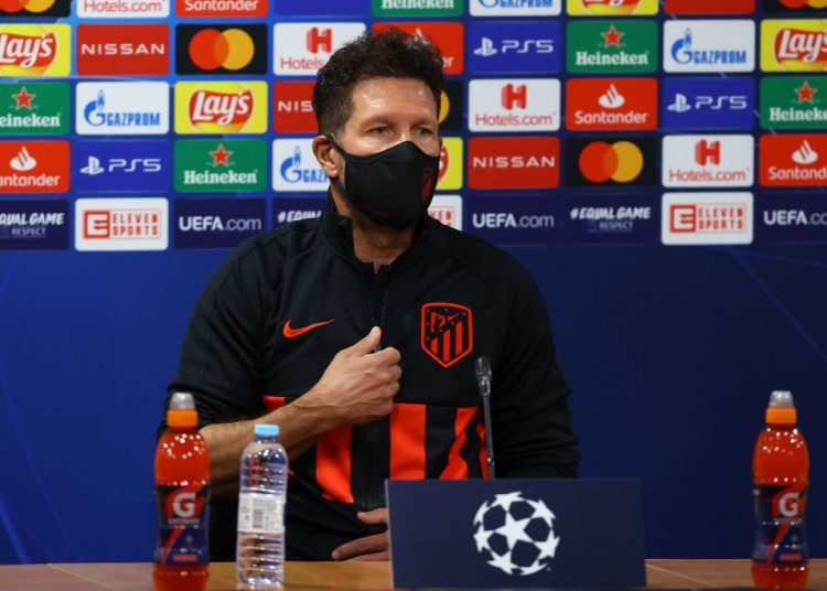 LISBON, PORTUGAL - AUGUST 12: In this handout image provided by UEFA, Diego Simeone, Manager of Atletico Madrid speaks to the media while wearing a face mask during a press conference ahead of their UEFA Champions League quarter-finals match against RB Leipzig at Estadio Jose Alvalade on August 12, 2020 in Lisbon, Portugal. (Photo by UEFA - Handout/UEFA via Getty Images)
