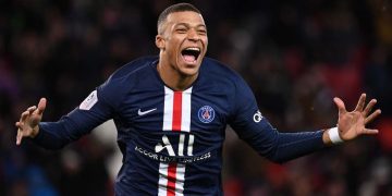 TOPSHOT - Paris Saint-Germain's French forward Kylian Mbappe celebrates after scoring a goal during the French L1 football match between Paris Saint-Germain (PSG) and Dijon, on February 29, 2020 at the Parc des Princes stadium in Paris. (Photo by FRANCK FIFE / AFP) (Photo by FRANCK FIFE/AFP via Getty Images)