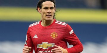 (FILES) In this file photo taken on February 14, 2021 Manchester United's Uruguayan striker Edinson Cavani plays during the English Premier League football match between West Bromwich Albion and Manchester United at The Hawthorns stadium in West Bromwich, central England. - Manchester United manager Ole Gunnar Solskjaer said it "doesn't make sense" for his players to travel for international duty later this month if they have to quarantine on their return and miss games as a result. Arrivals in Britain from "Red List" countries are subject to 10 days' hotel confinement. South American countries and Portugal are among the nations on that list meaning United stars Bruno Fernandes of Portugal and Uruguayan striker Edinson Cavani could be missing for World Cup qualifiers. Liverpool manager Jurgen Klopp said his club will also withdraw players if they are forced to quarantine, casting the participation of Brazilian trio Alisson Becker, Roberto Firmino and Fabinho and Portugal forward Diogo Jota into doubt. (Photo by Naomi Baker / POOL / AFP) / RESTRICTED TO EDITORIAL USE. No use with unauthorized audio, video, data, fixture lists, club/league logos or 'live' services. Online in-match use limited to 120 images. An additional 40 images may be used in extra time. No video emulation. Social media in-match use limited to 120 images. An additional 40 images may be used in extra time. No use in betting publications, games or single club/league/player publications. /