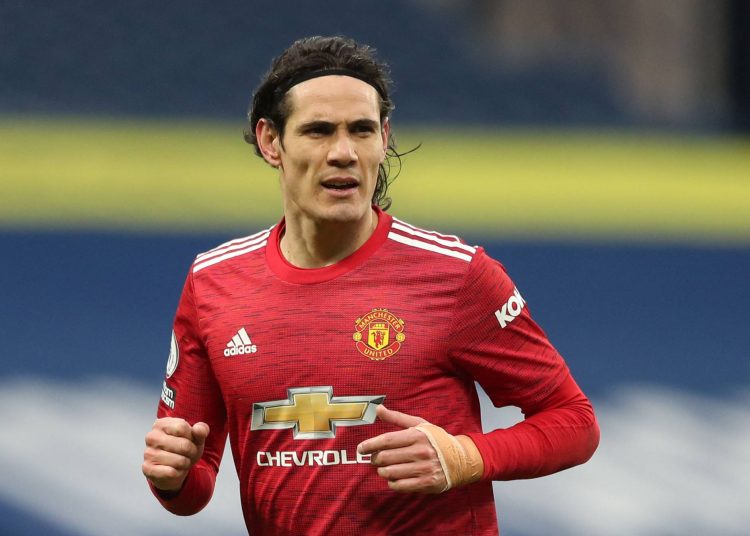 (FILES) In this file photo taken on February 14, 2021 Manchester United's Uruguayan striker Edinson Cavani plays during the English Premier League football match between West Bromwich Albion and Manchester United at The Hawthorns stadium in West Bromwich, central England. - Manchester United manager Ole Gunnar Solskjaer said it "doesn't make sense" for his players to travel for international duty later this month if they have to quarantine on their return and miss games as a result. Arrivals in Britain from "Red List" countries are subject to 10 days' hotel confinement. South American countries and Portugal are among the nations on that list meaning United stars Bruno Fernandes of Portugal and Uruguayan striker Edinson Cavani could be missing for World Cup qualifiers. Liverpool manager Jurgen Klopp said his club will also withdraw players if they are forced to quarantine, casting the participation of Brazilian trio Alisson Becker, Roberto Firmino and Fabinho and Portugal forward Diogo Jota into doubt. (Photo by Naomi Baker / POOL / AFP) / RESTRICTED TO EDITORIAL USE. No use with unauthorized audio, video, data, fixture lists, club/league logos or 'live' services. Online in-match use limited to 120 images. An additional 40 images may be used in extra time. No video emulation. Social media in-match use limited to 120 images. An additional 40 images may be used in extra time. No use in betting publications, games or single club/league/player publications. /