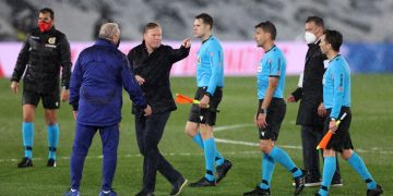 MADRID, SPAIN - APRIL 10: Ronald Koeman, Head Coach of FC Barcelona talks with Referee, Jesus Gil Manzano following the La Liga Santander match between Real Madrid and FC Barcelona at Estadio Alfredo Di Stefano on April 10, 2021 in Madrid, Spain. Sporting stadiums around Spain remain under strict restrictions due to the Coronavirus Pandemic as Government social distancing laws prohibit fans inside venues resulting in games being played behind closed doors.  (Photo by Angel Martinez/Getty Images)