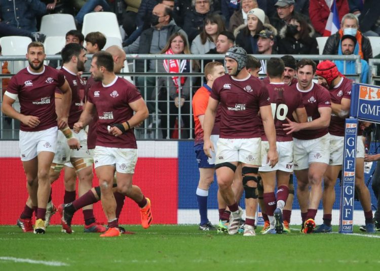 Georgia's right wing Akaki Tabutsadze (R) celebrates with teammates after scoring a try during the international rugby union Test match between France and Georgia at The Matmut Atlantique Stadium in Bordeaux, south-western France on November 14, 2021. (Photo by Romain PERROCHEAU / AFP) (Photo by ROMAIN PERROCHEAU/AFP via Getty Images)